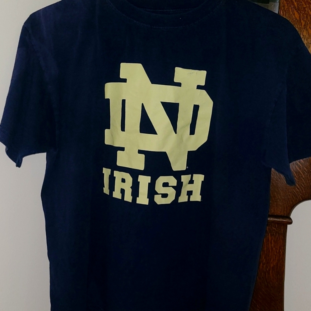 Men's size extra large navy blue with gold decals brand is NCAA